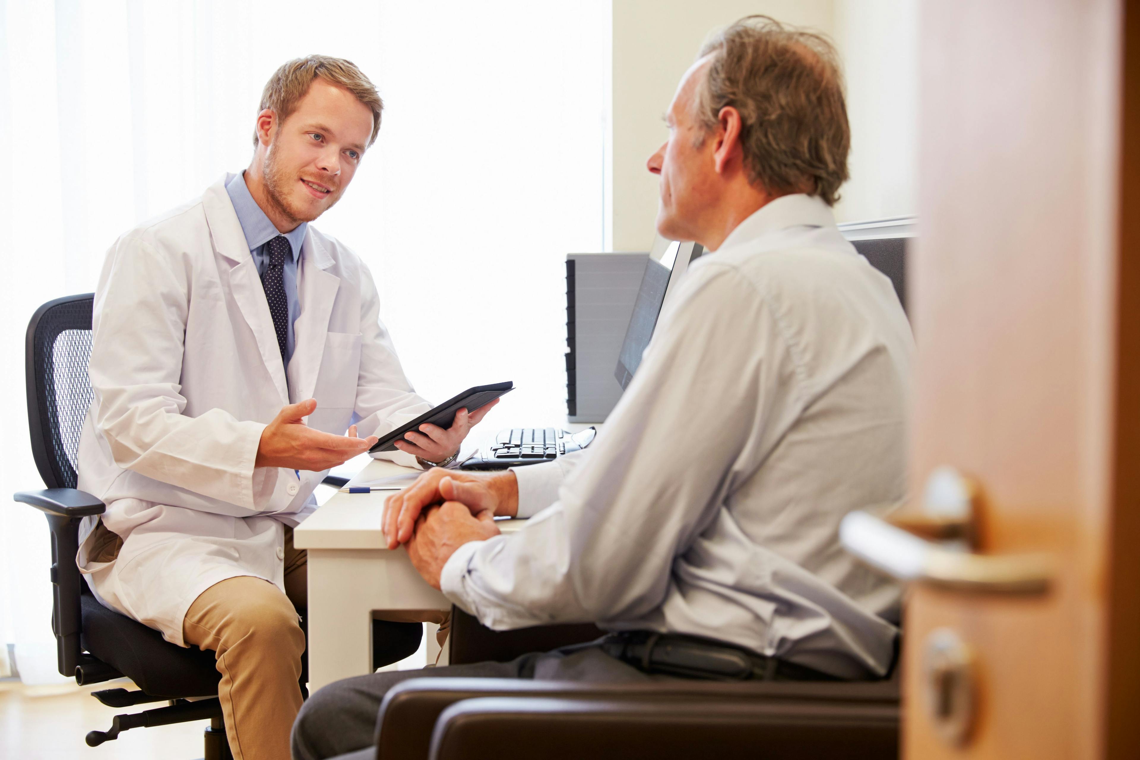 Doctor Consulting with Male Patient