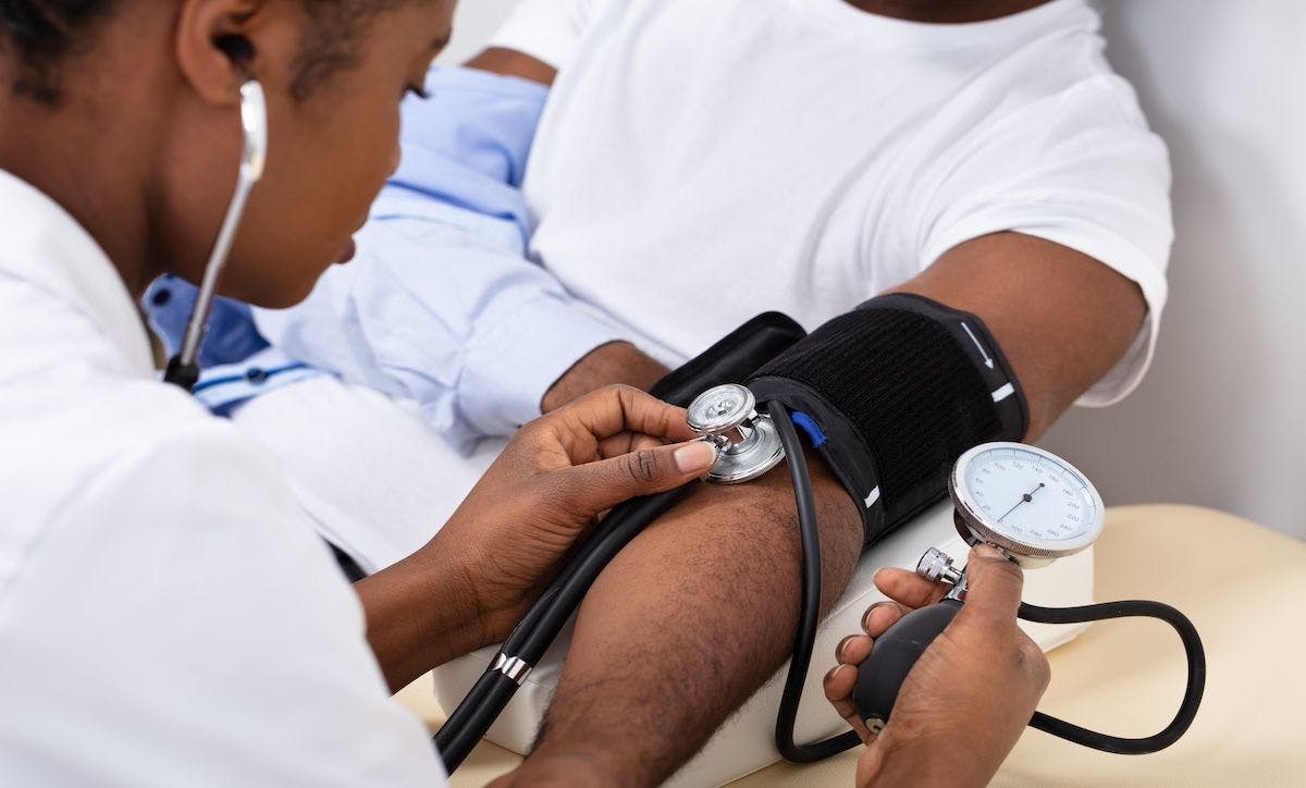 Doctor Measuring Blood Pressure Of Patient | Image Credit: Andrey Popov - stock.adobe.com