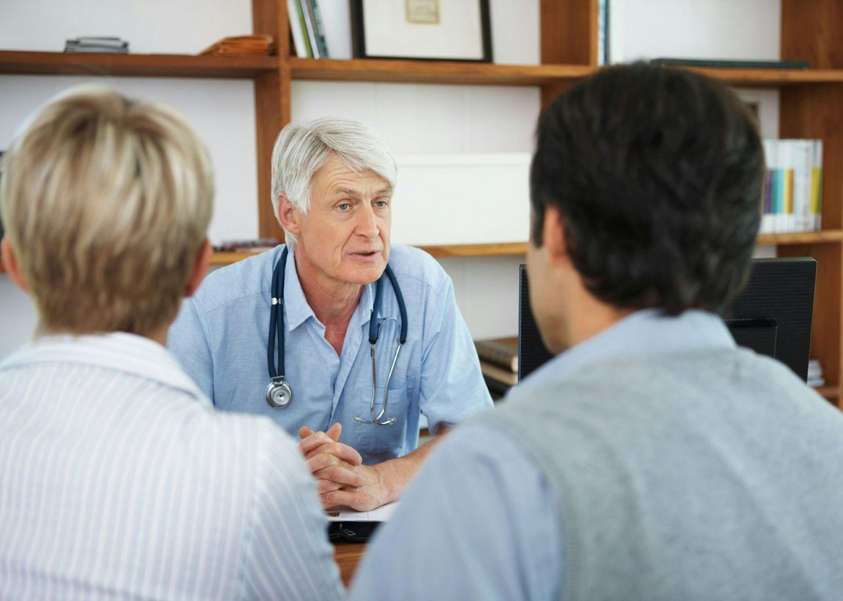 Doctor speaking with patient and family