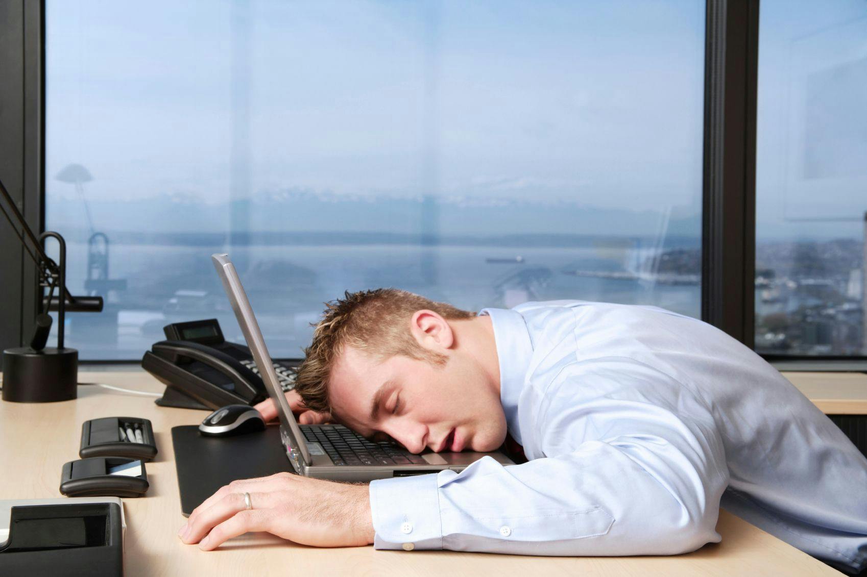 business man falling asleep at desk