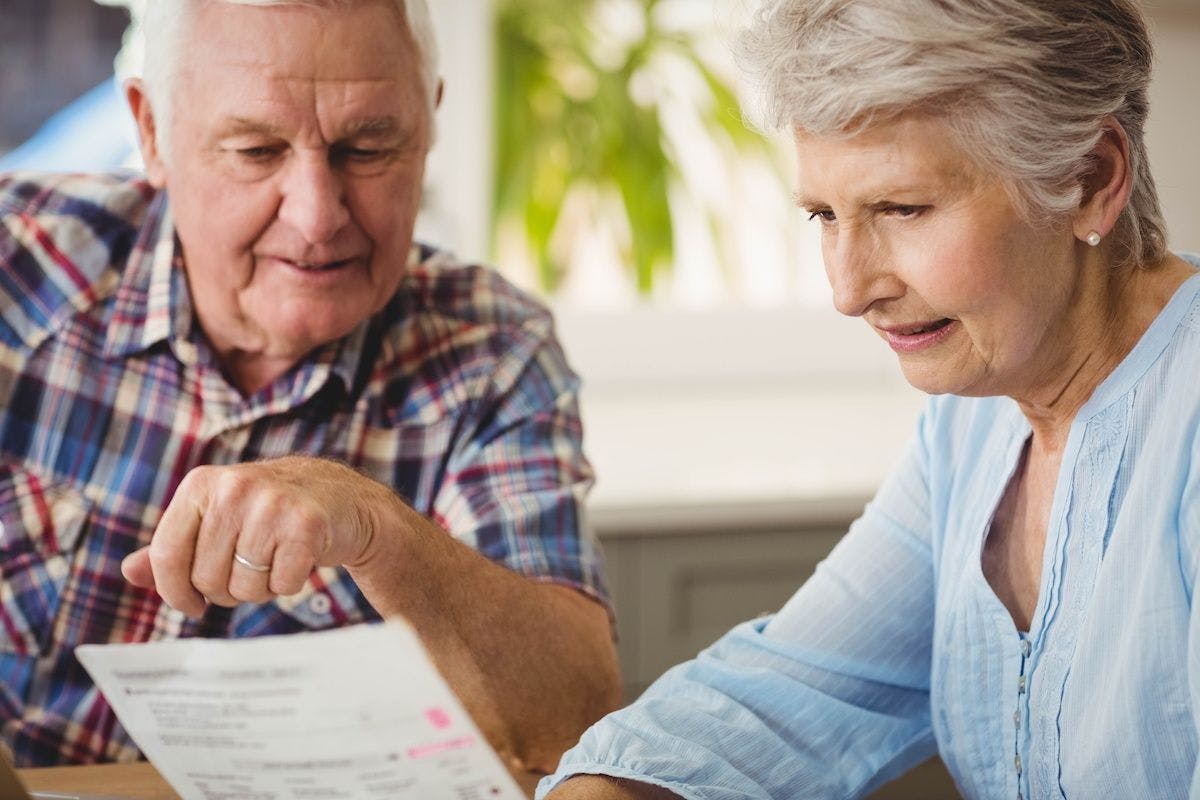 Older couple discussing their bills | Image Credit: © WavebreakmediaMicro - stock.adobe.com