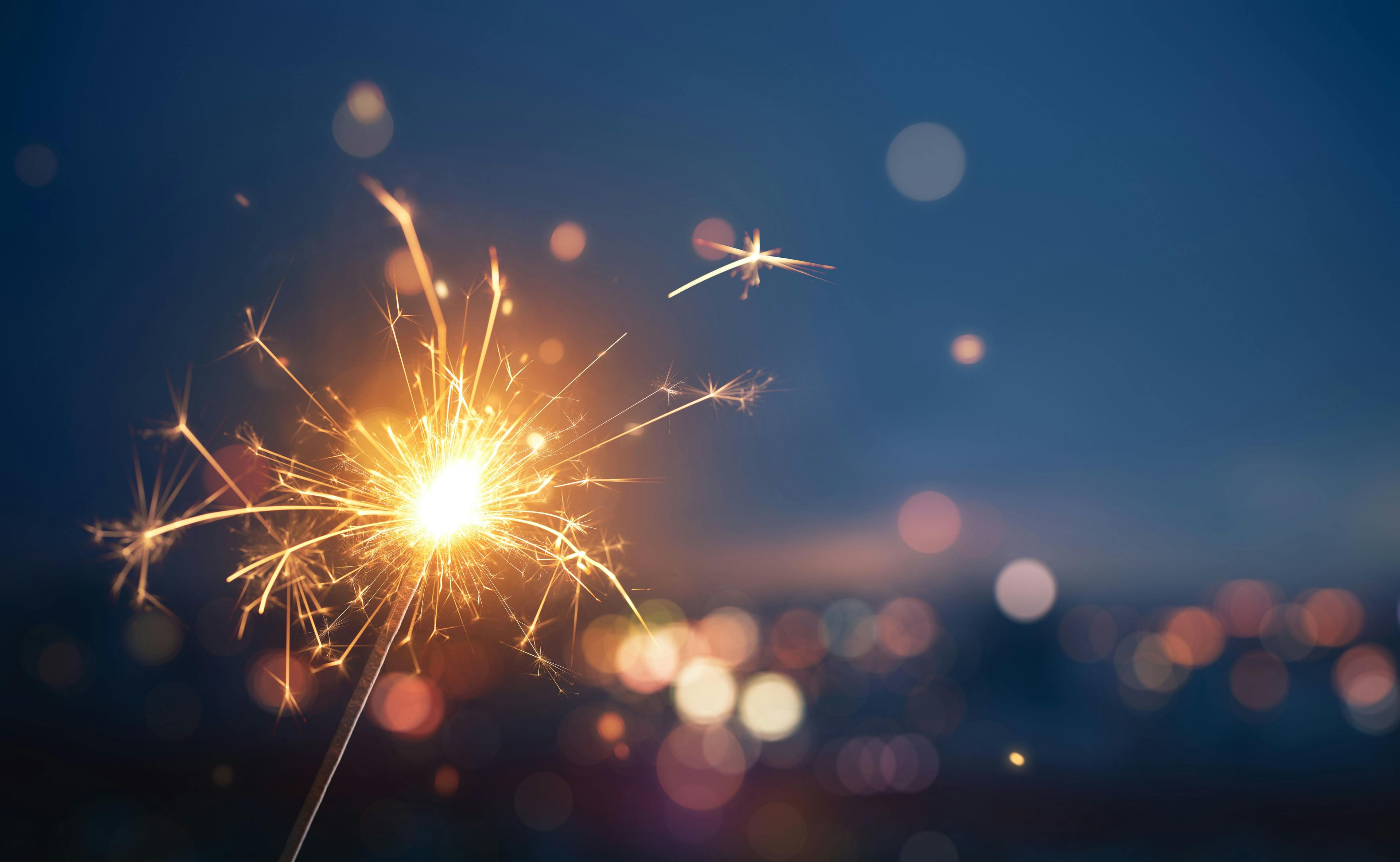 Sparkler with blurred busy city light background | Image credit: phive2015 - stock.adobe.com