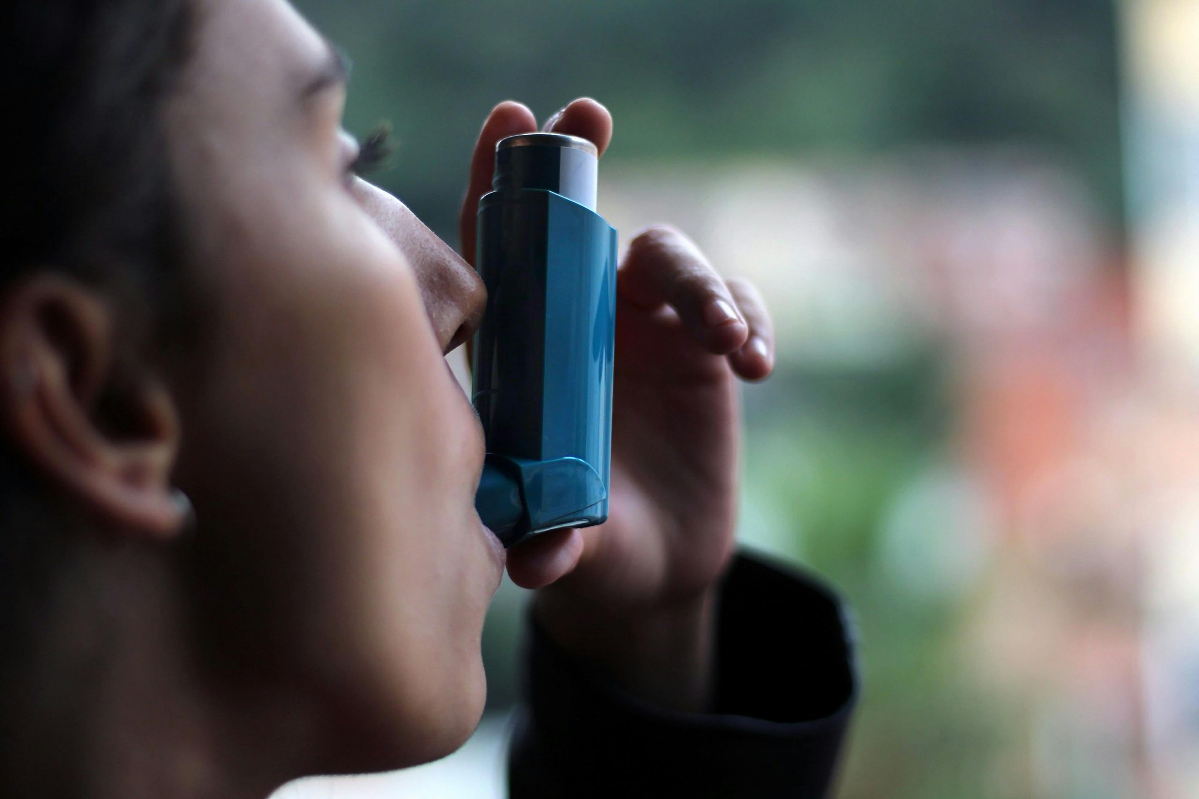Health and medicine - Young girl using blue asthma inhaler to prevent an asthma attack | Image credit: © DALU11 - stock.adobe.com