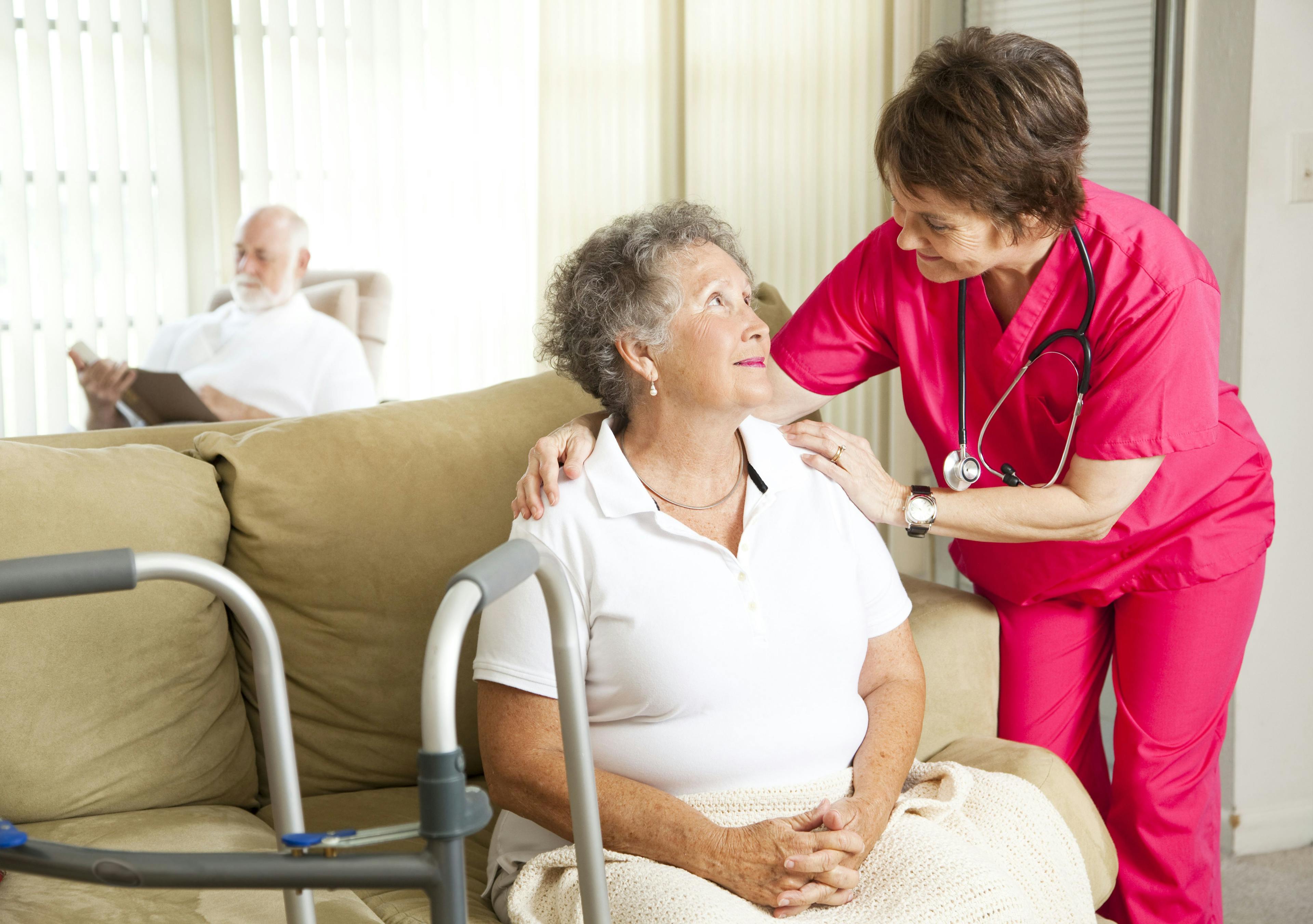 Nurse with patient in nursing home