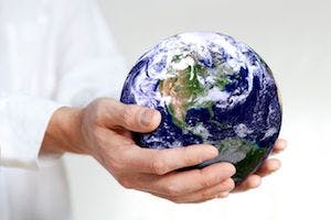 image of a globe being held in hands