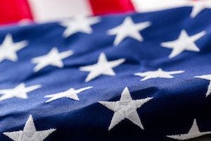 Close up of American flag with the stars in the foreground