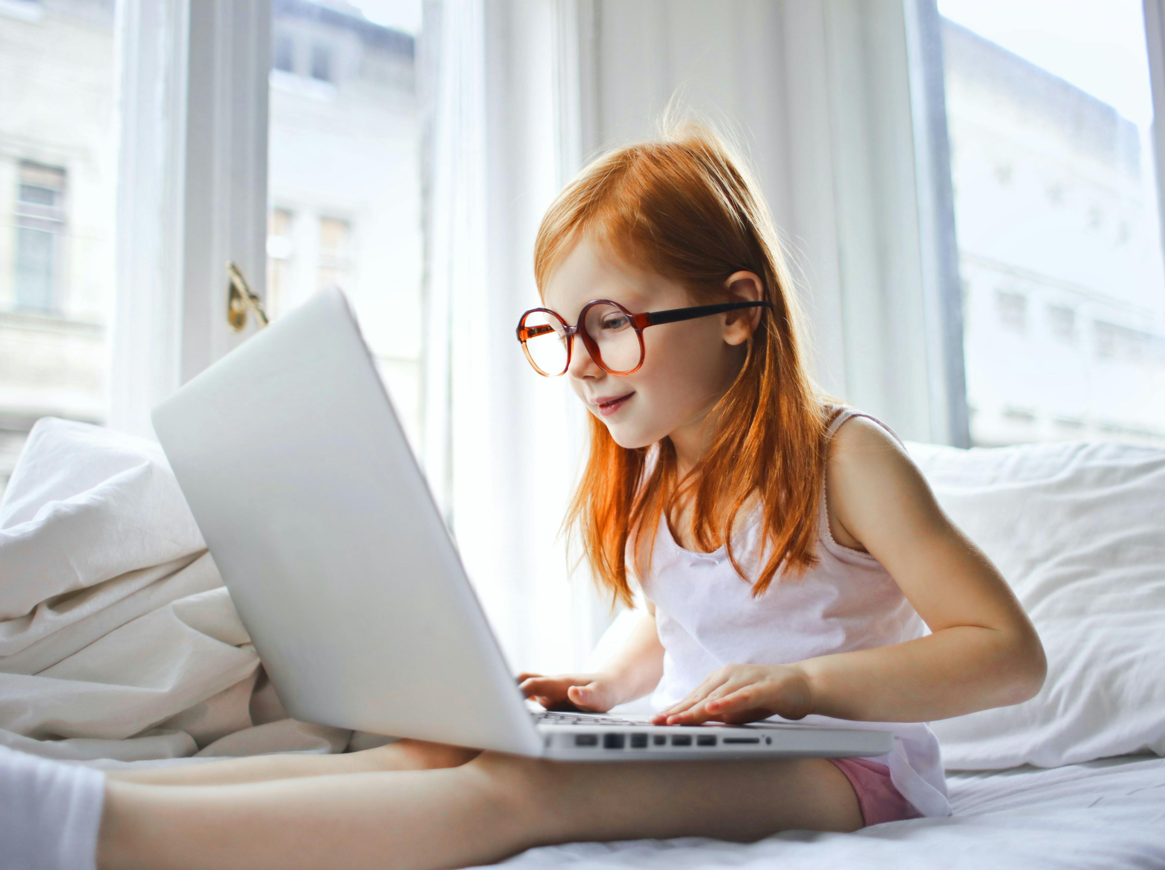 Girl with glasses on computer
