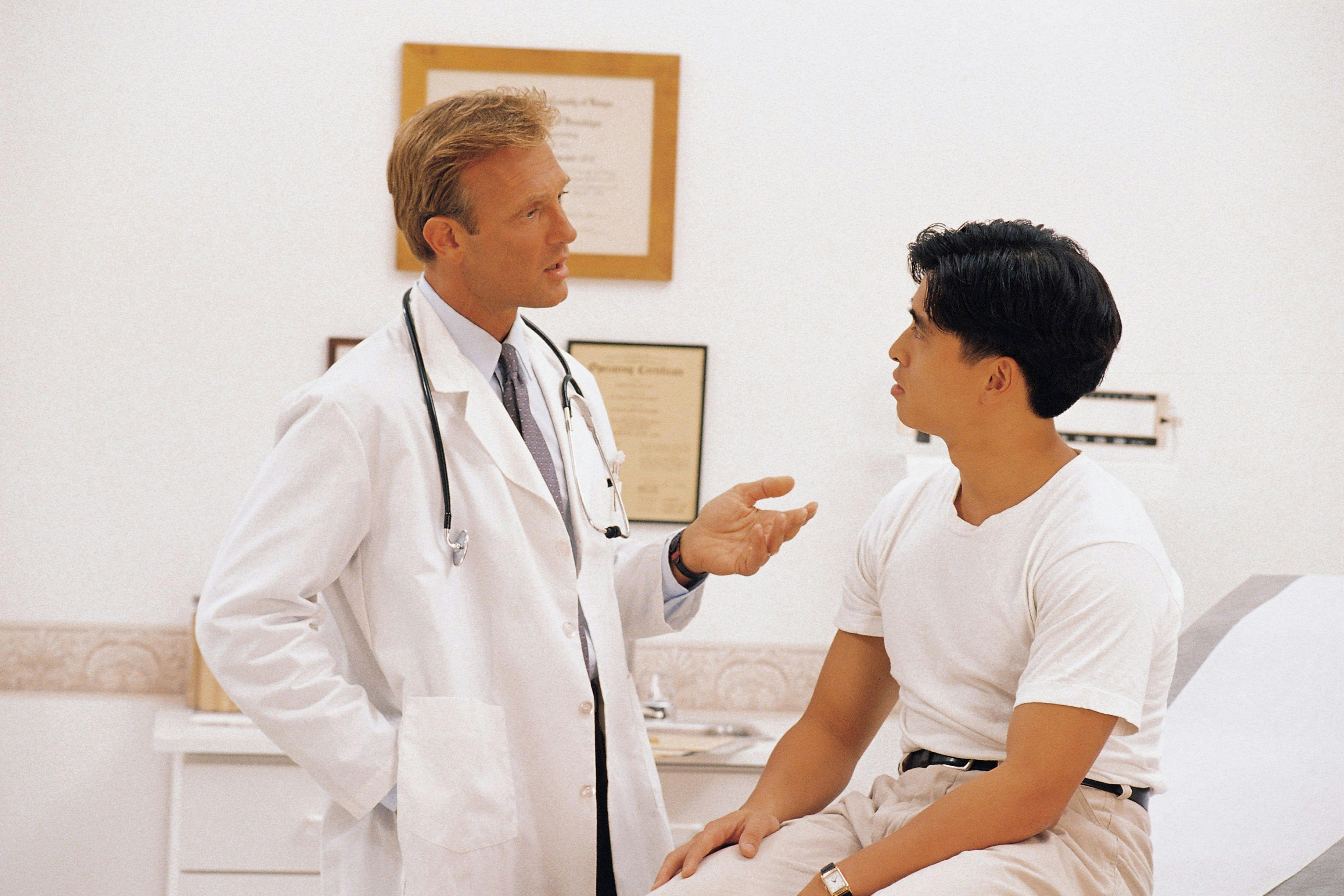 Young man with physician.