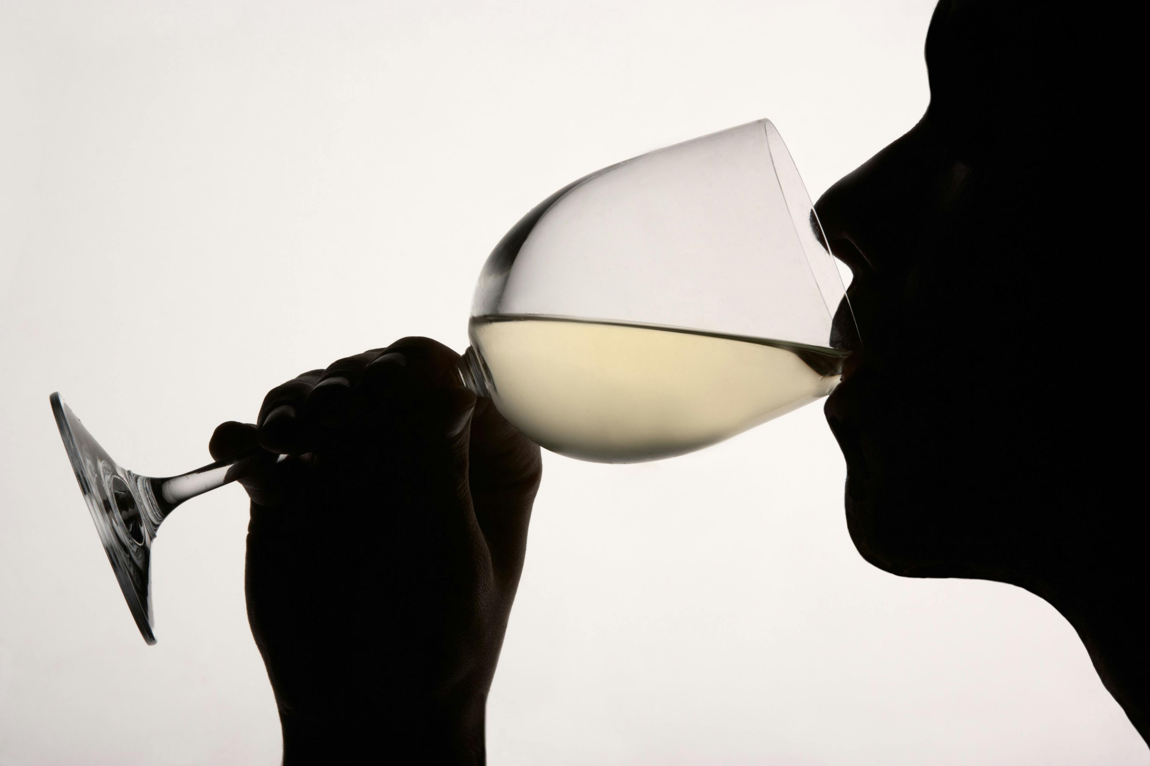 Silhouette of person drinking white wine | Image credit: Monkey Business – stock.adobe.com