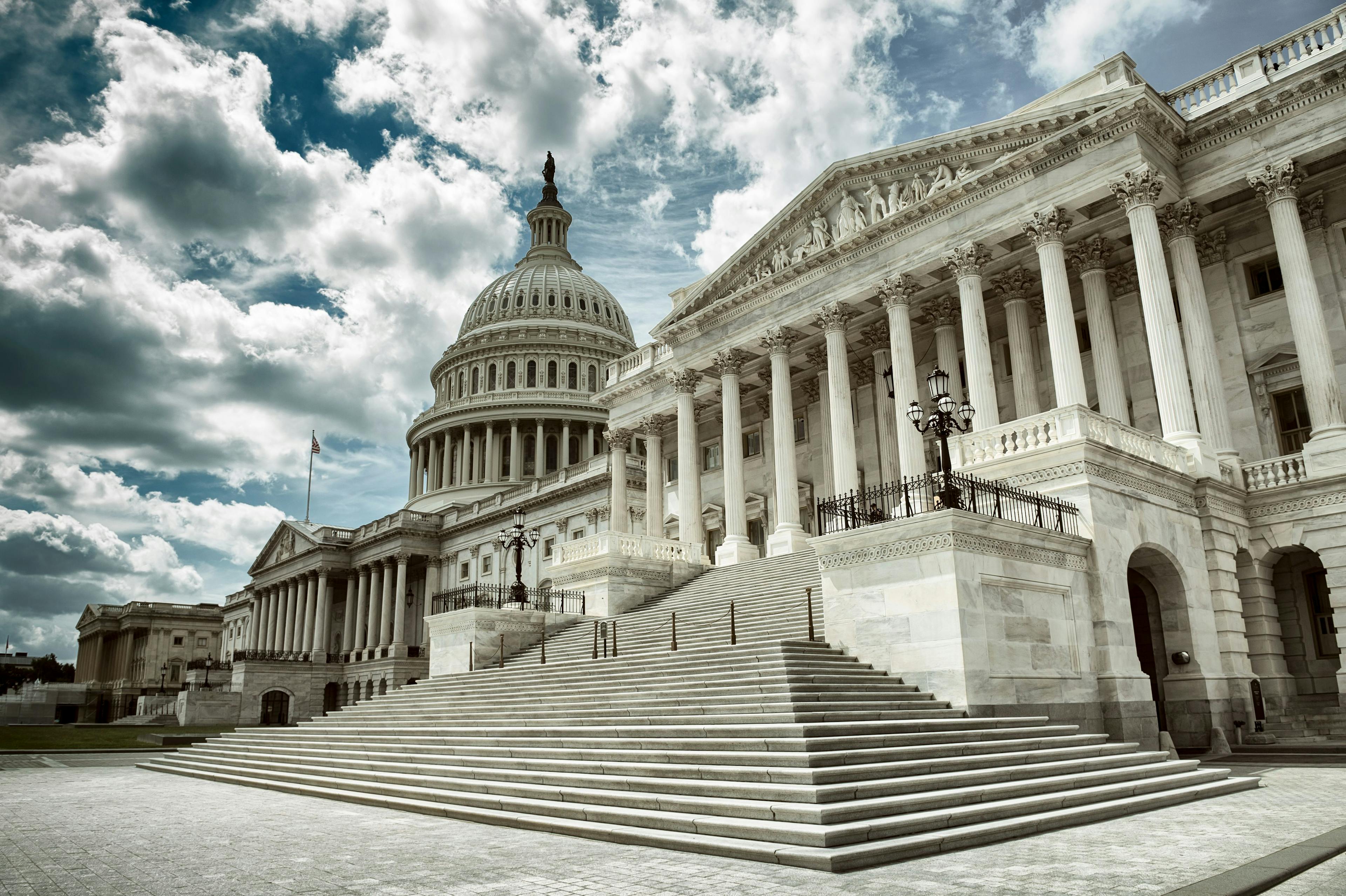 Stark cloudy weather over empty exterior view of the US Capitol Building in Washington DC, USA | Image Credit: lazyllama - stock.adobe.com