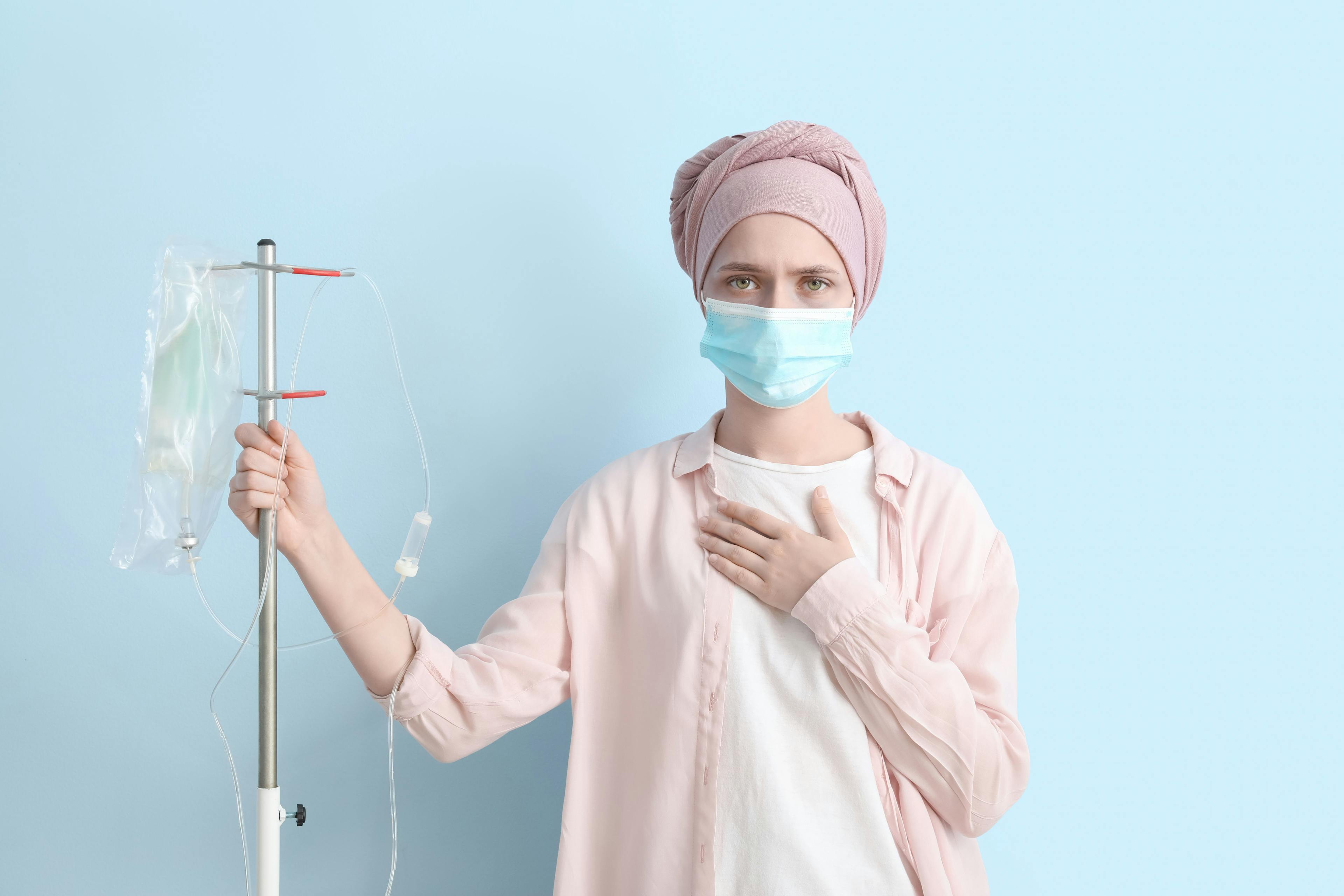 Woman undergoing cancer therapy wearing surgical mask | Image Credit: Pixel-Shot - stock.adobe.com