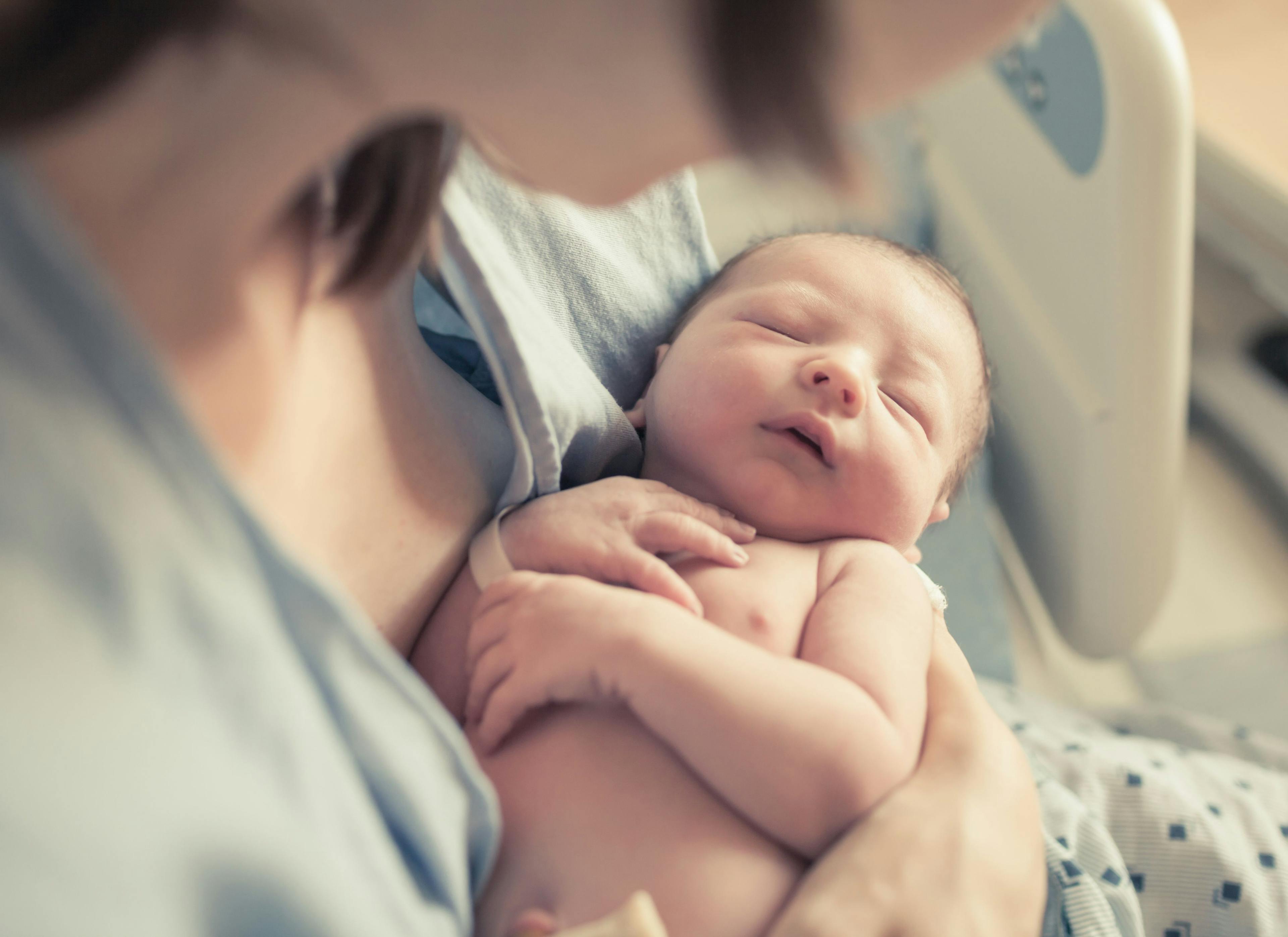 Mother holding newborn baby | Image credit: kieferpix - stock.adobe.com