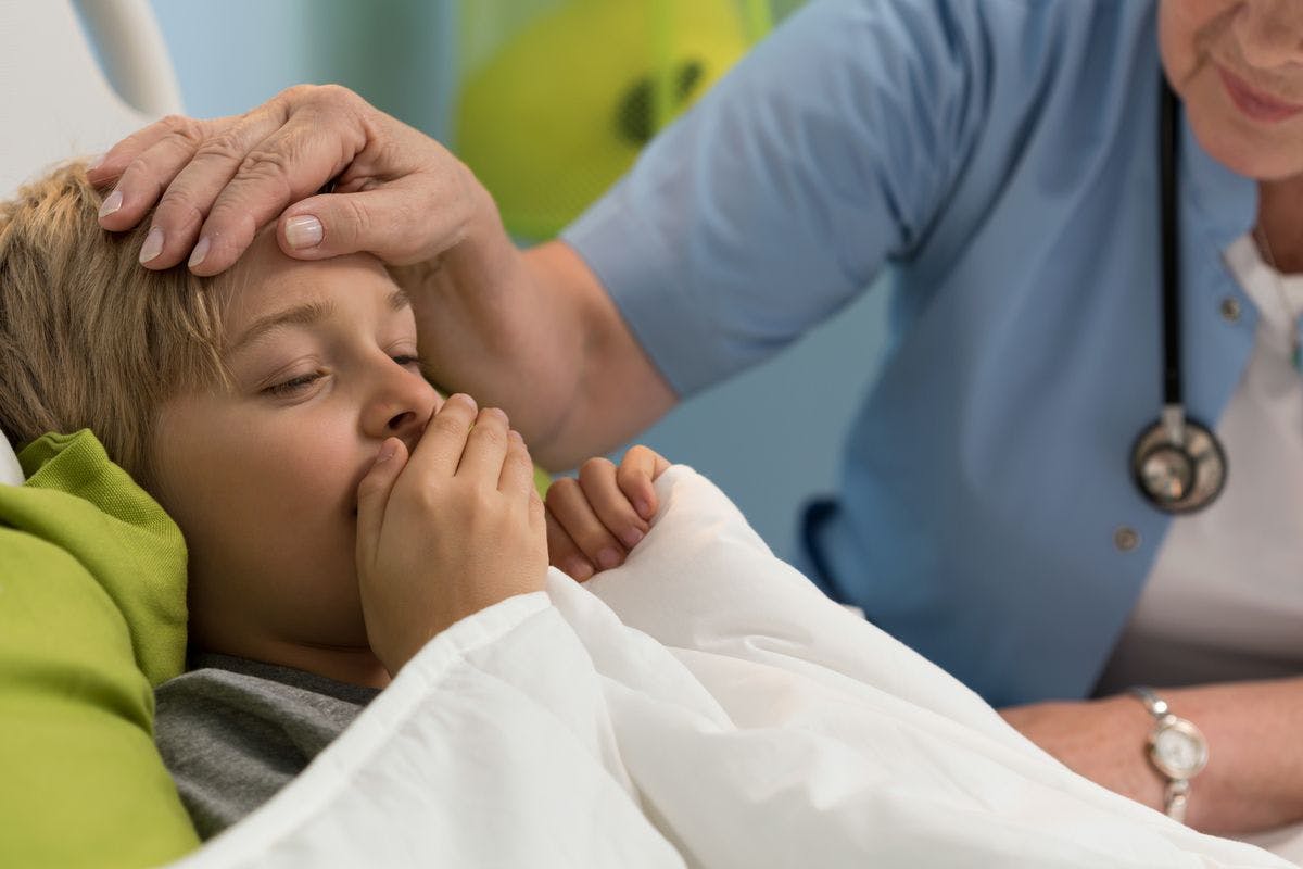 Image of a sick kid in the hospital