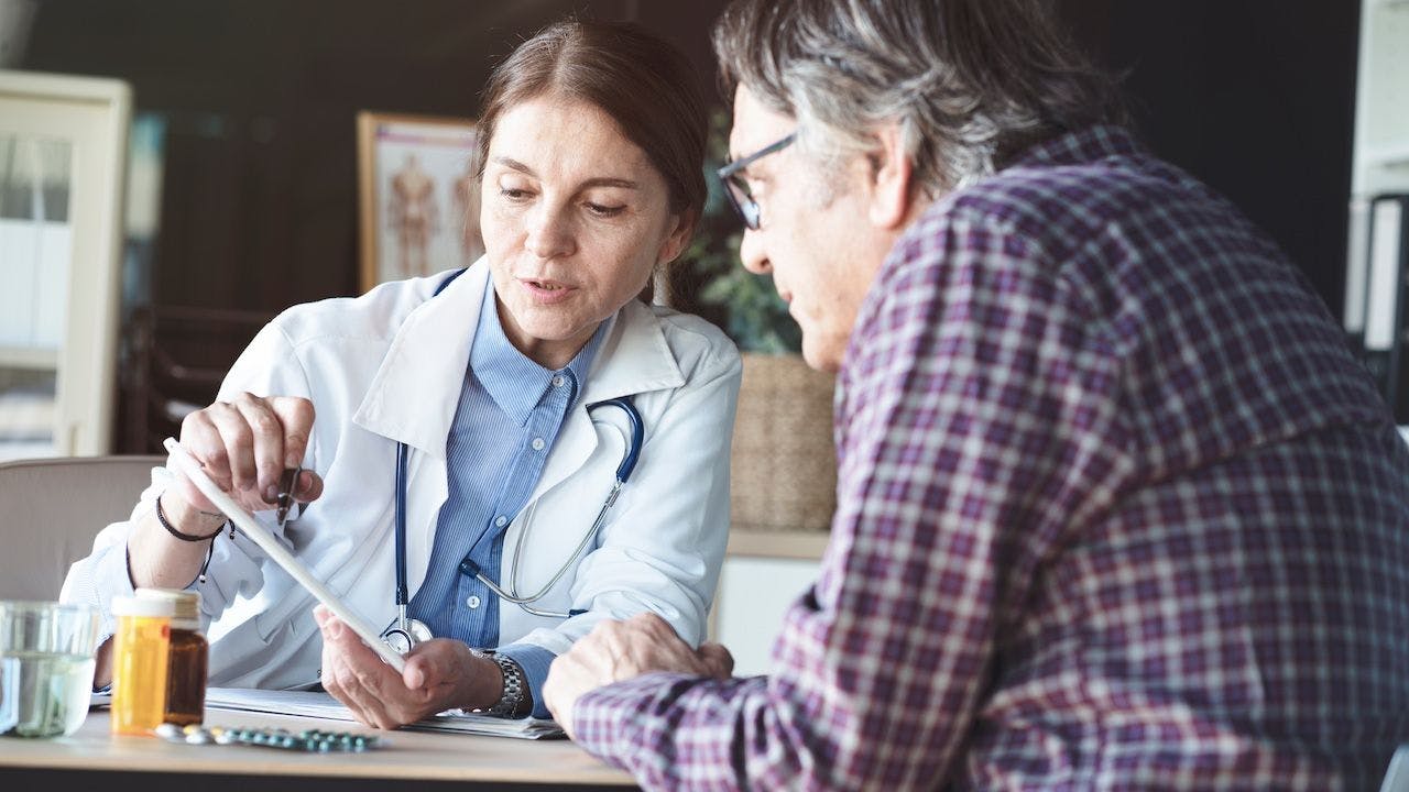 Doctor with patient in medical office | Image Credit: sebra - stock.adobe.com