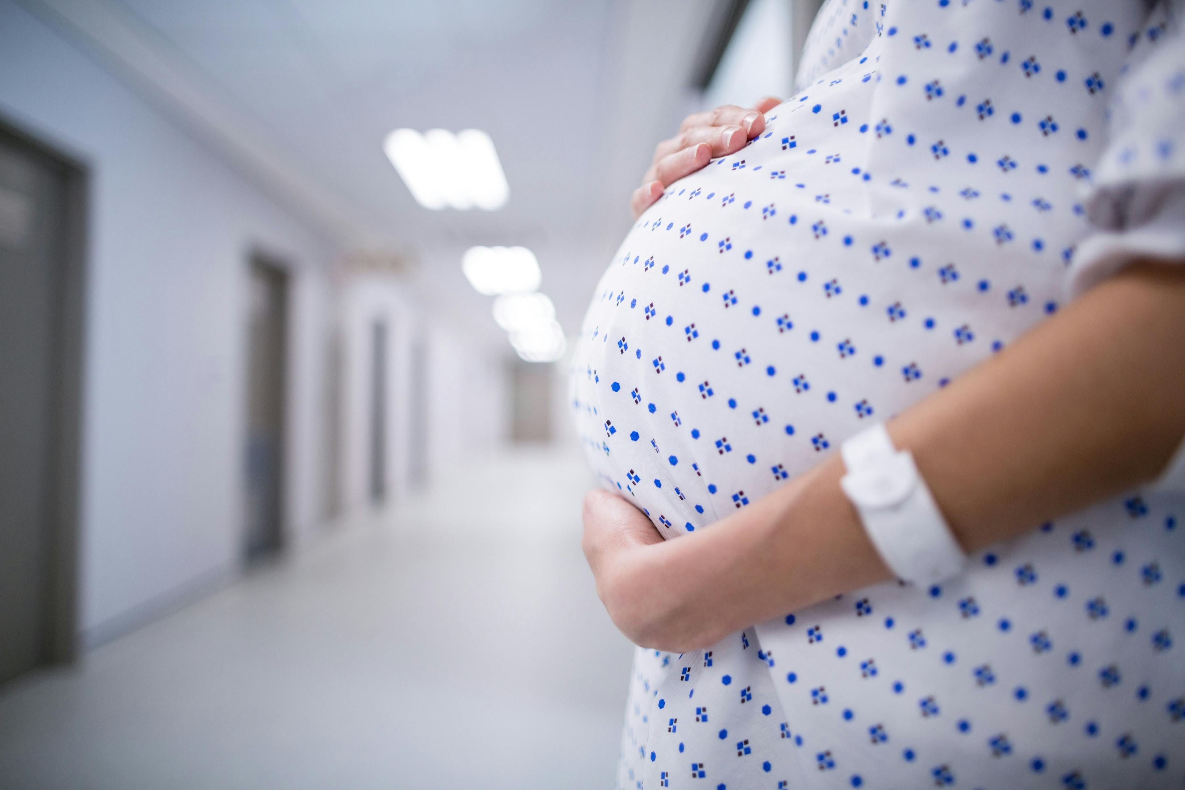 pregnant woman in a hospital gown