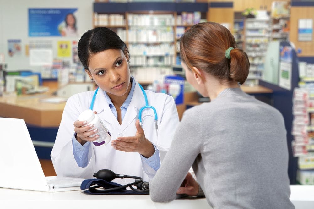 picture of pharmacist counseling a patient