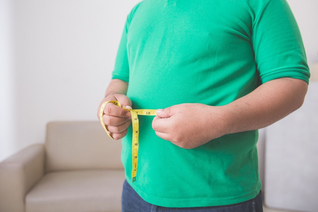 Person measuring body fat.