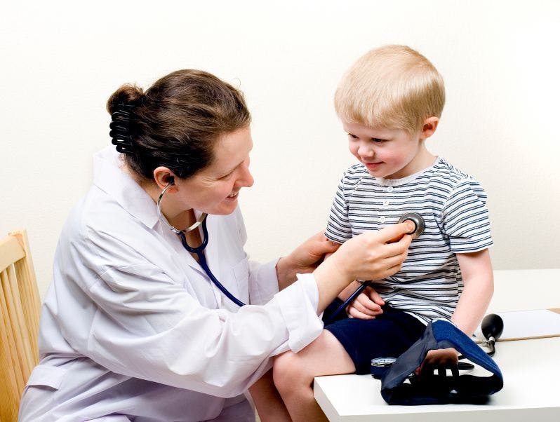 Pediatrician examining child