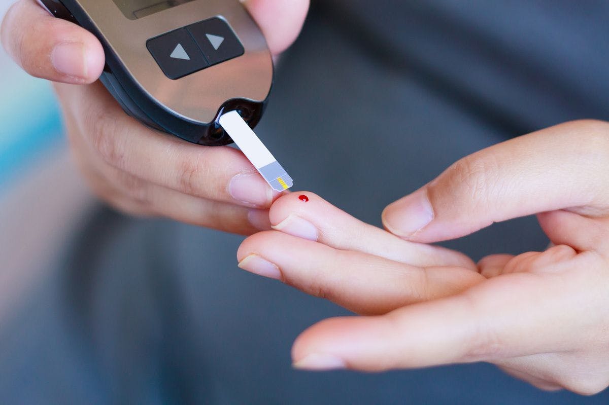 Person testing glucose levels