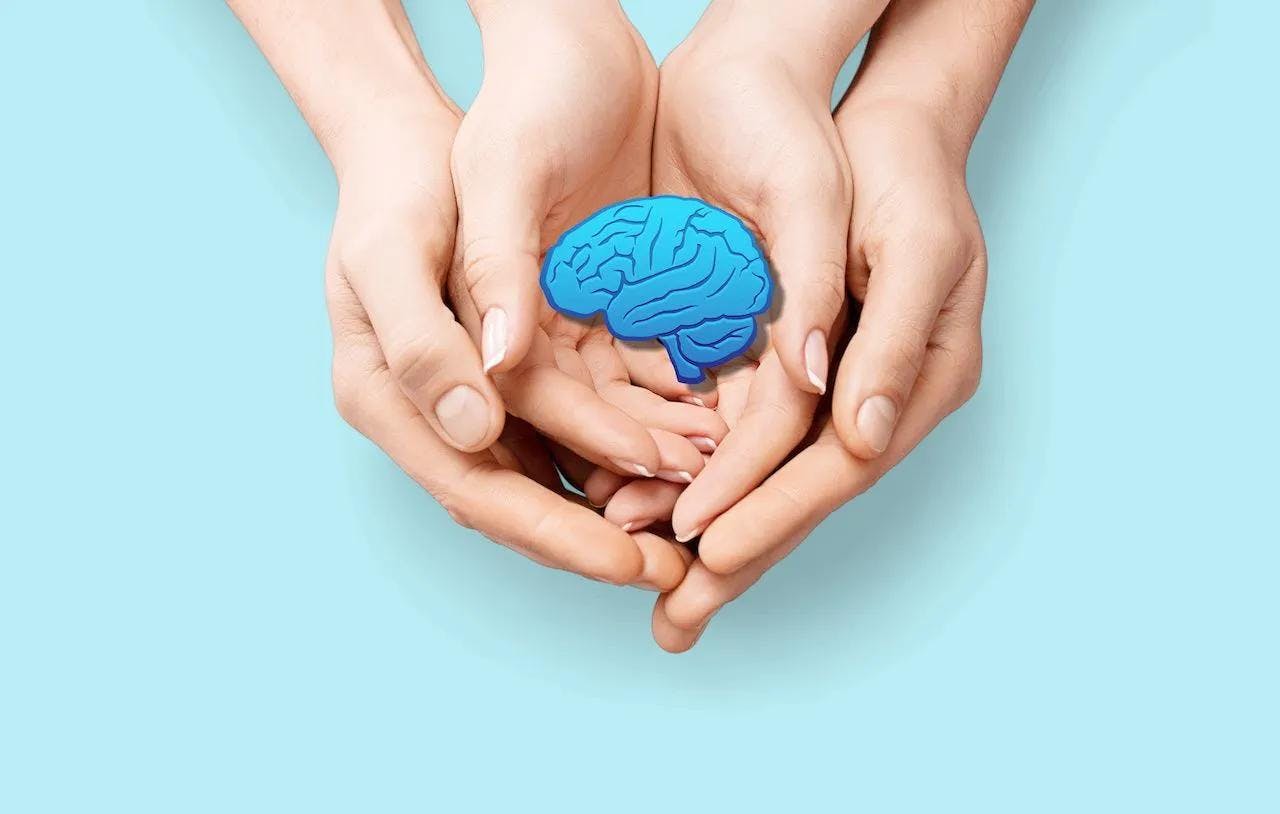 Adult and child holding brain