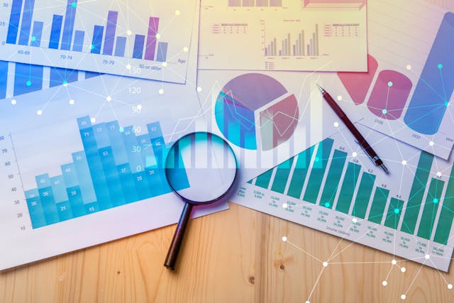 magnifying glass and documents with analytics data | Image credit: tonefotografia – stock.adobe.com