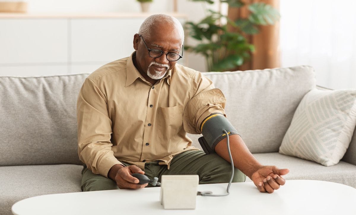 Senior African American Man Measuring Arterial Blood Pressure At Home | Image Credit:  Prostock-studio - stock.adobe.com