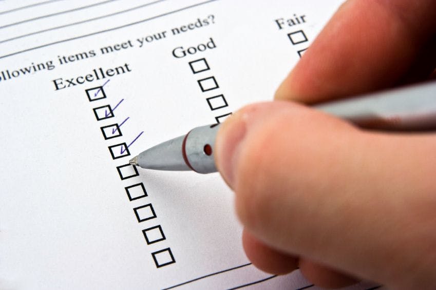 image of a person filling out a survey