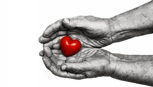 Heart in weathered hands