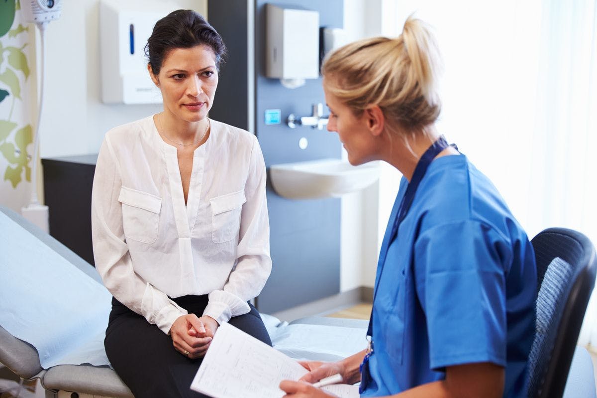 Image of female patient and doctor having consultation