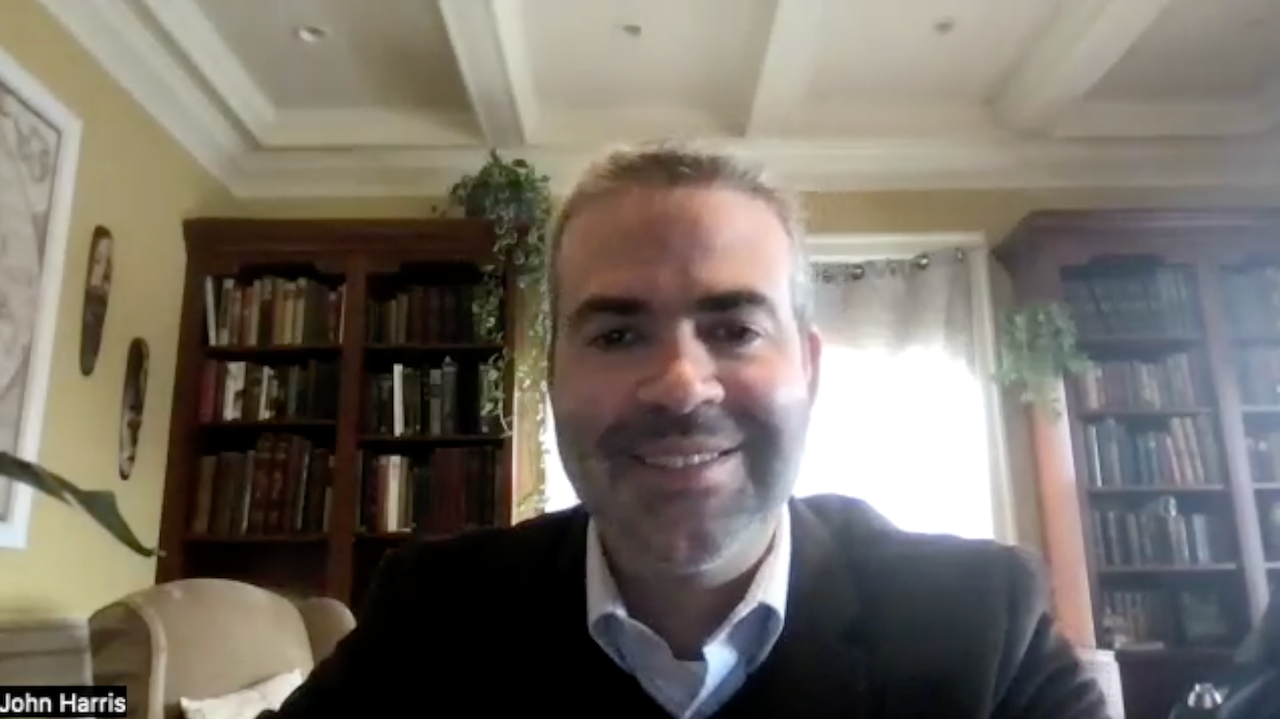 Screenshot of John Harris, MD, PhD, smiling in a Zoom video interview