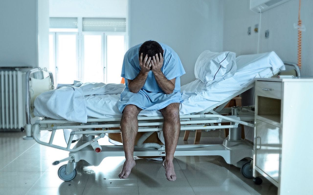 desperate man sitting at hospital bed alone sad and devastated: © Wordley Calvo Stock - stock.adobe.com
