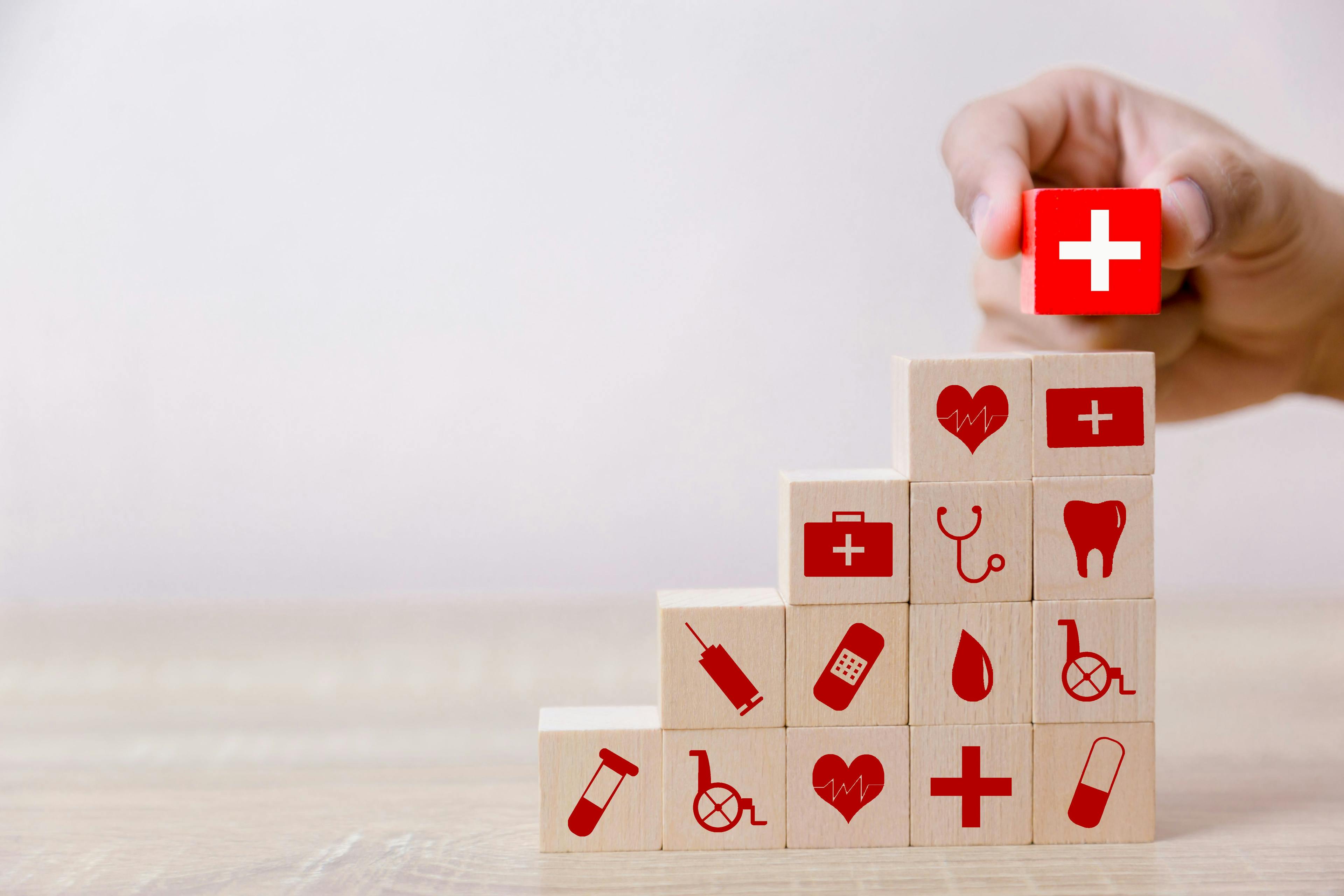 Wooden blocks with health care icons | Image credit: A stockphoto - stock.adobe.com