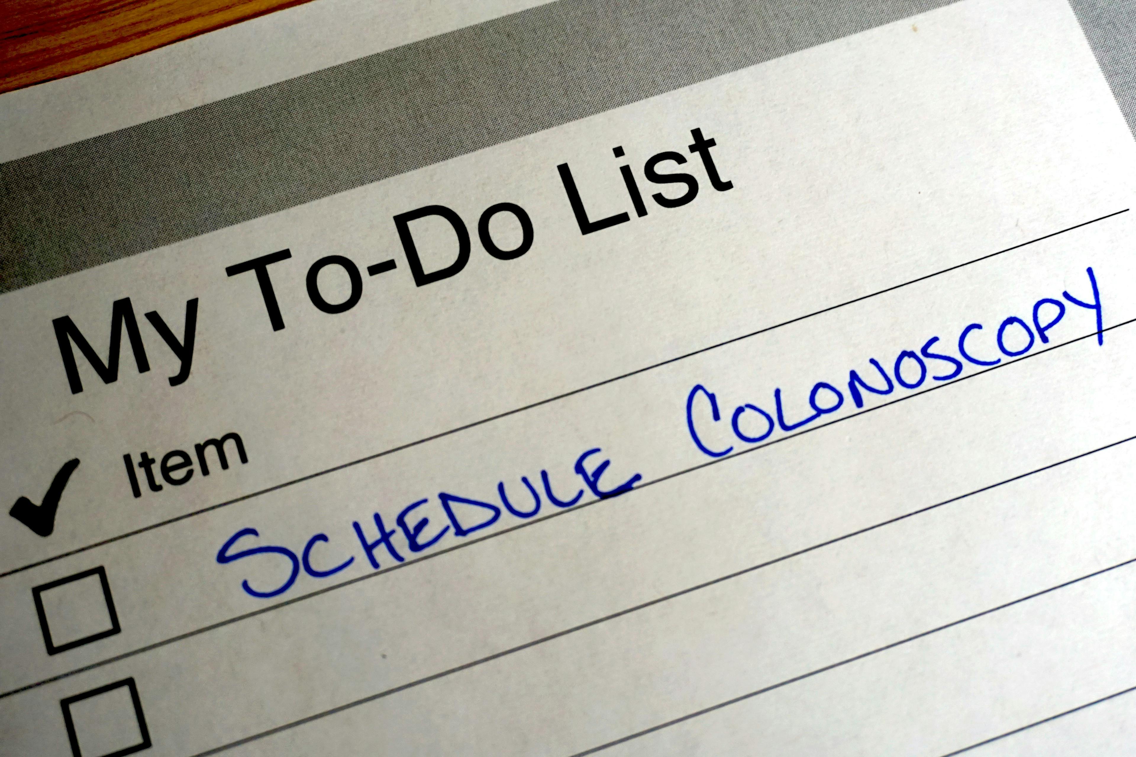 Handwritten reminder on a to do list to schedule a colonoscopy | Image credit: OntheRun Photo - stock.adobe.com