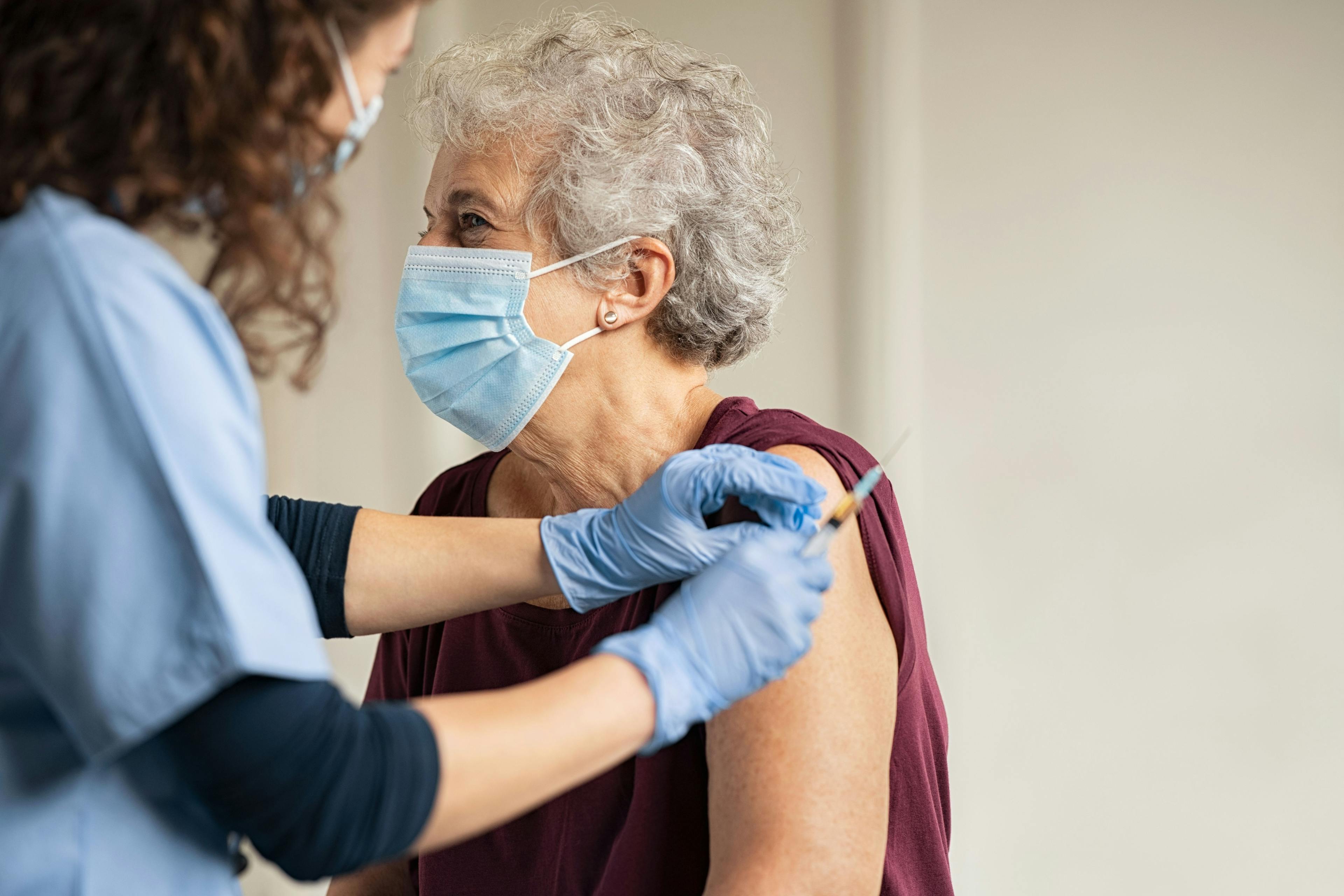 Doctor giving Covid vaccine to senior woman | Image credit: Rido - stock.adobe.com