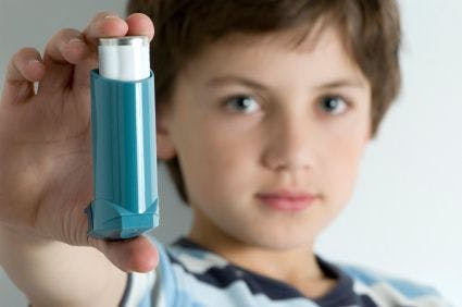 child holding inhaler