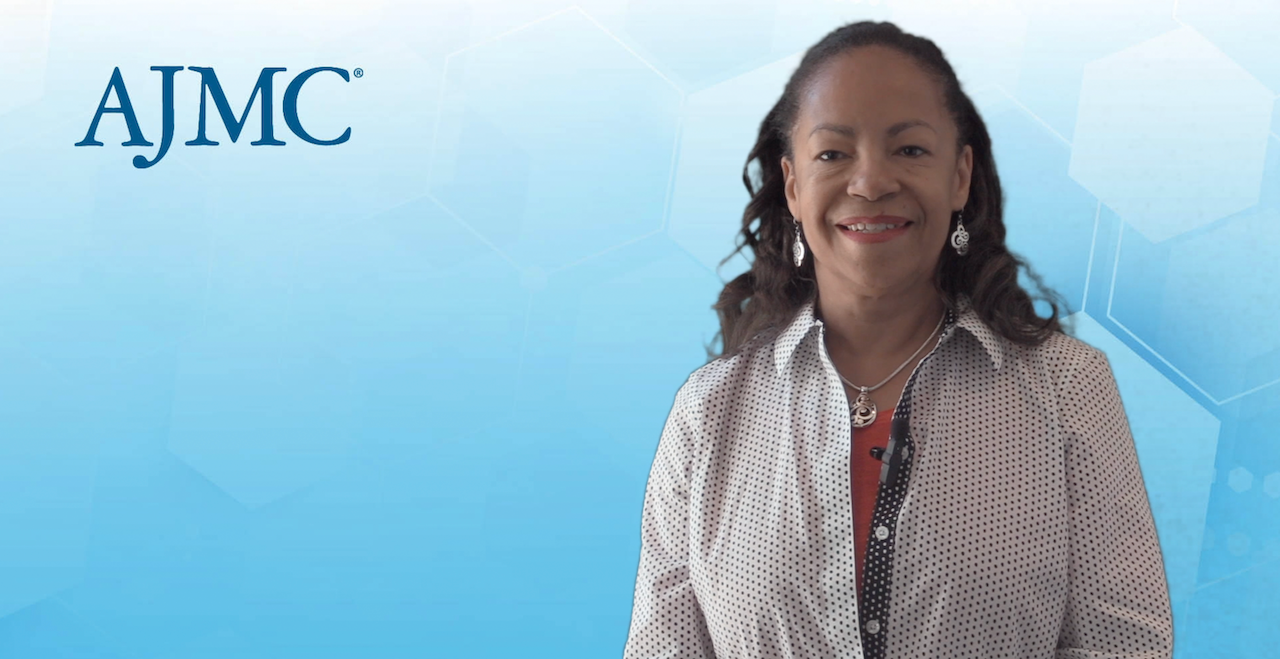 Miriam Atkins, MD, president of Community Oncology Alliance, during a video interview on blue AJMC background