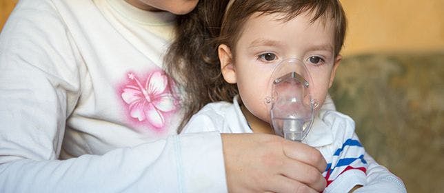 Child using nebulizer