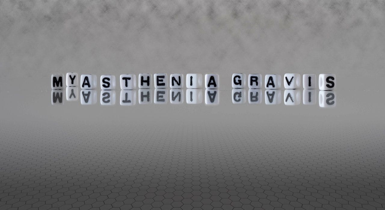 myasthenia gravis word or concept represented by black and white letter cubes on a grey horizon background stretching to infinity | Image Credit: lexiconimages - stock.adobe.com