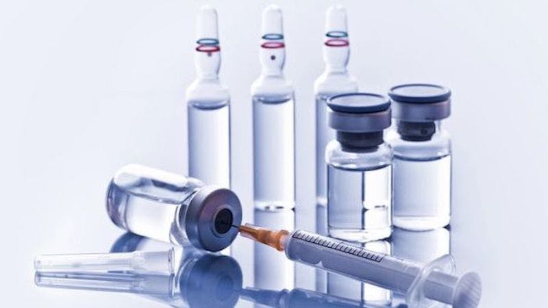 syringe and vials of drug