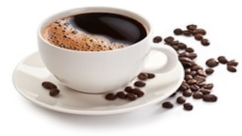 a cup of coffee with coffee beans