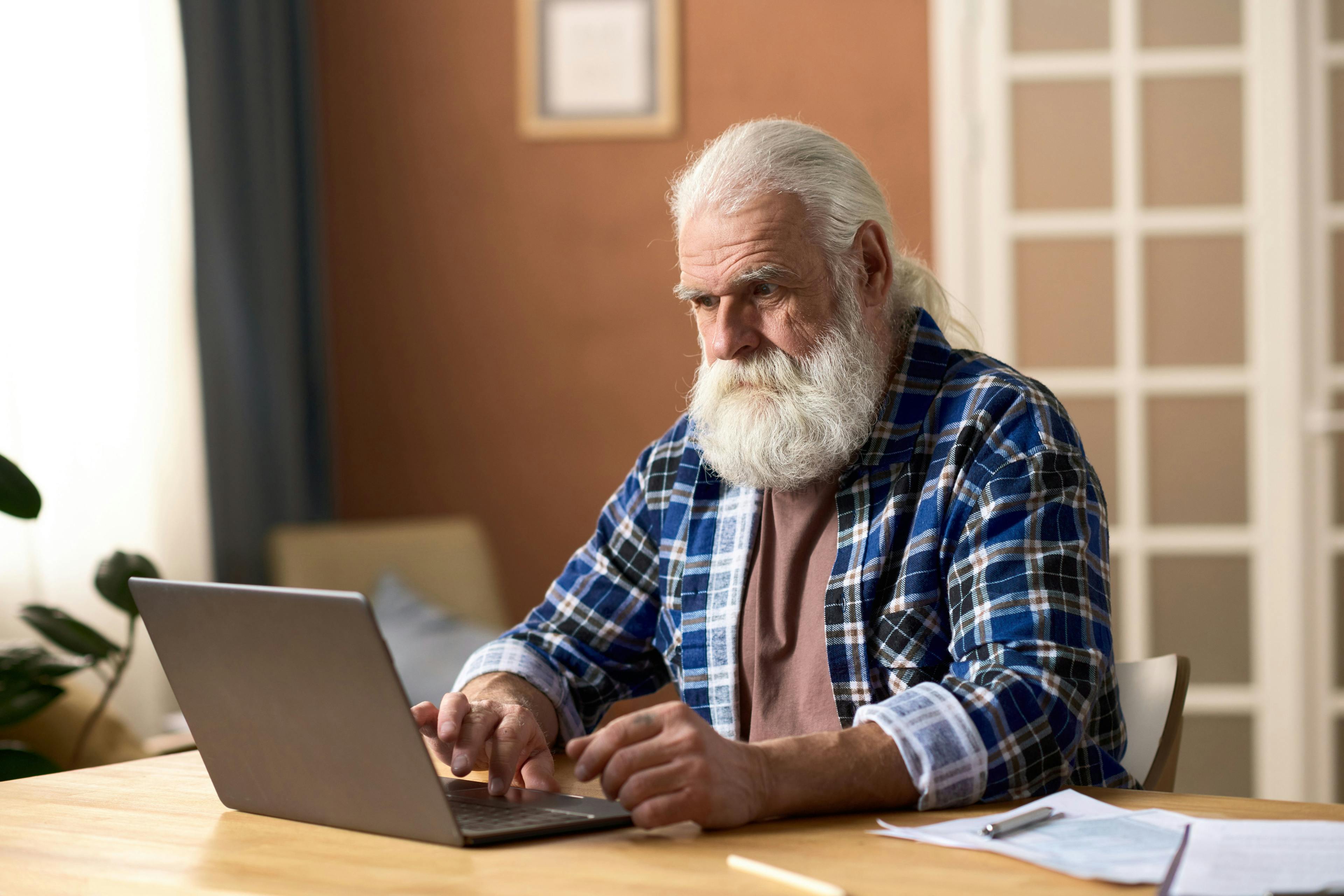 Older man with laptop | Image credit: Mediaphotos - stock.adobe.com