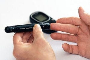 image of fingerstick in type 1 diabetes