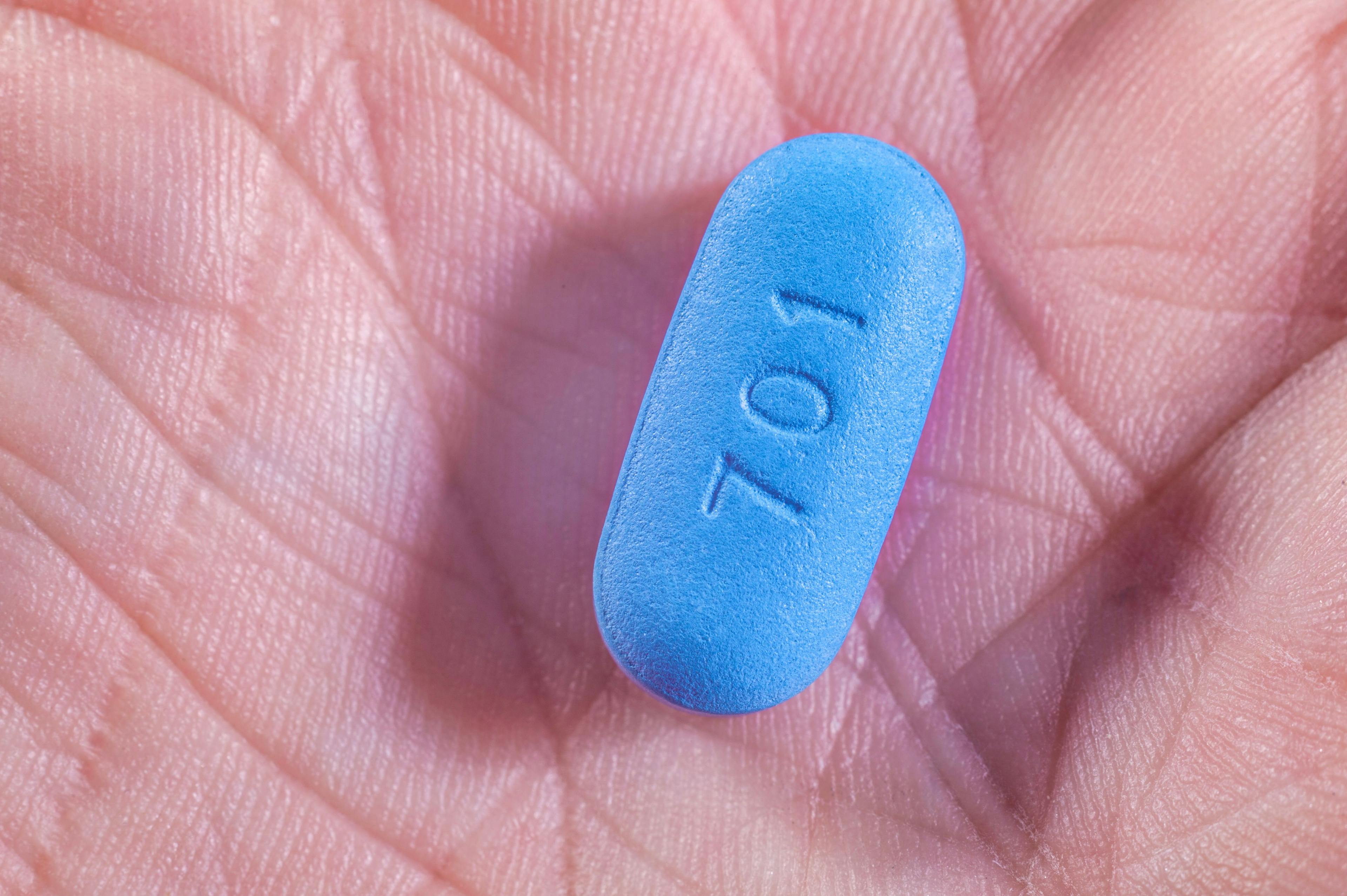 Hand holding Pill used for Pre-Exposure Prophylaxis (PrEP) to prevent HIV | Image credit: mbruxelle - stock.adobe.com
