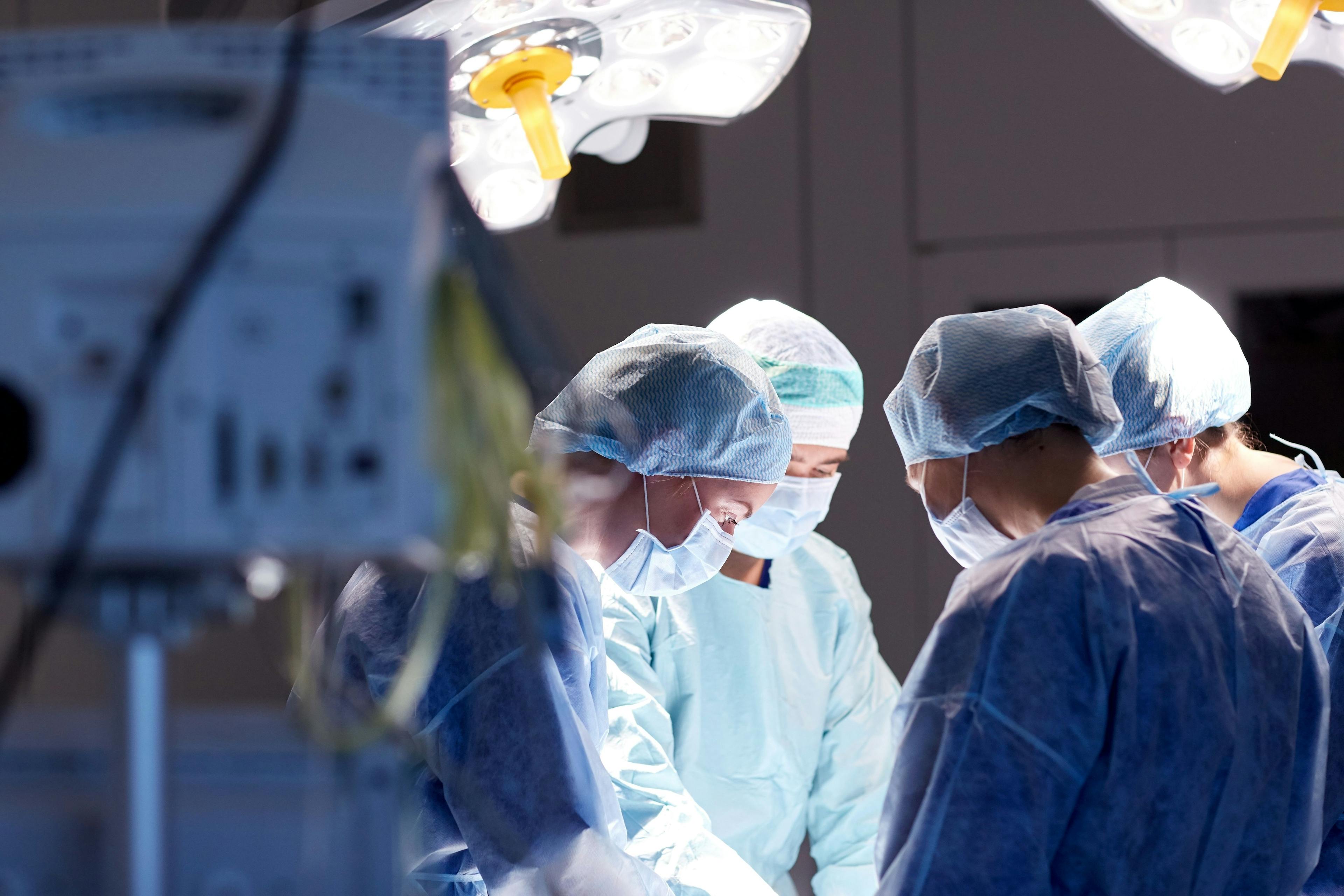 Group of surgeons in operating room | Image Credit: catinsyrup - stock.adobe.com