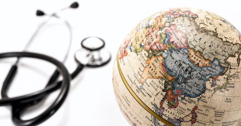 Stethoscope and globe map