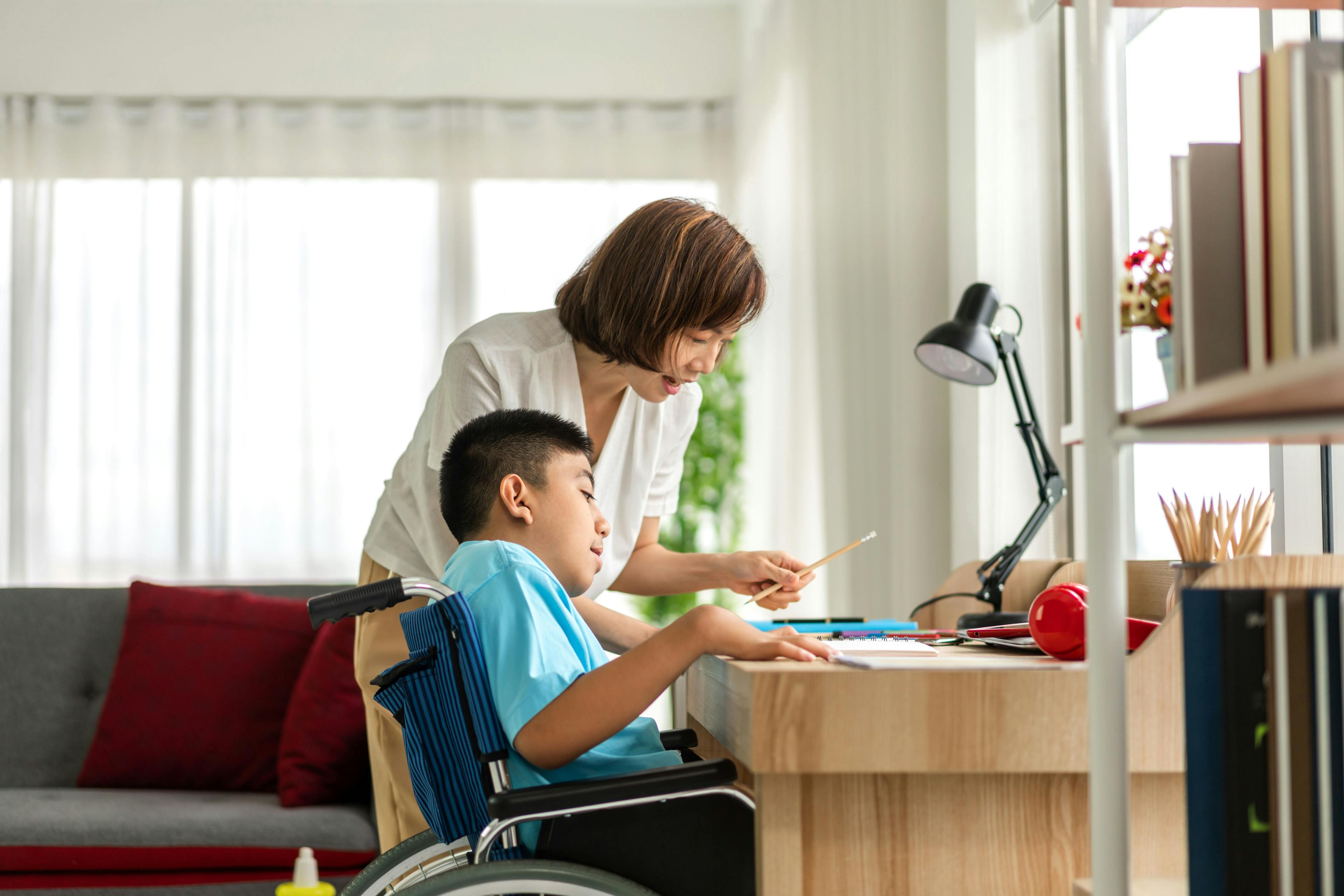 child in wheelchair and parent | Image credit: Art_Photo - stock.adobe.com