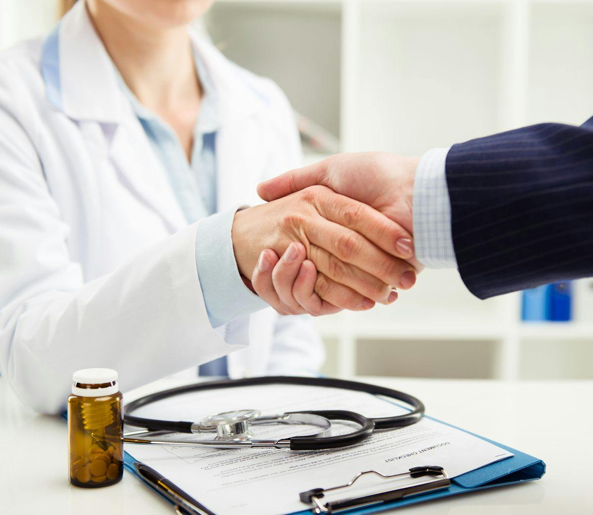 Handshake between pharmacist and payer