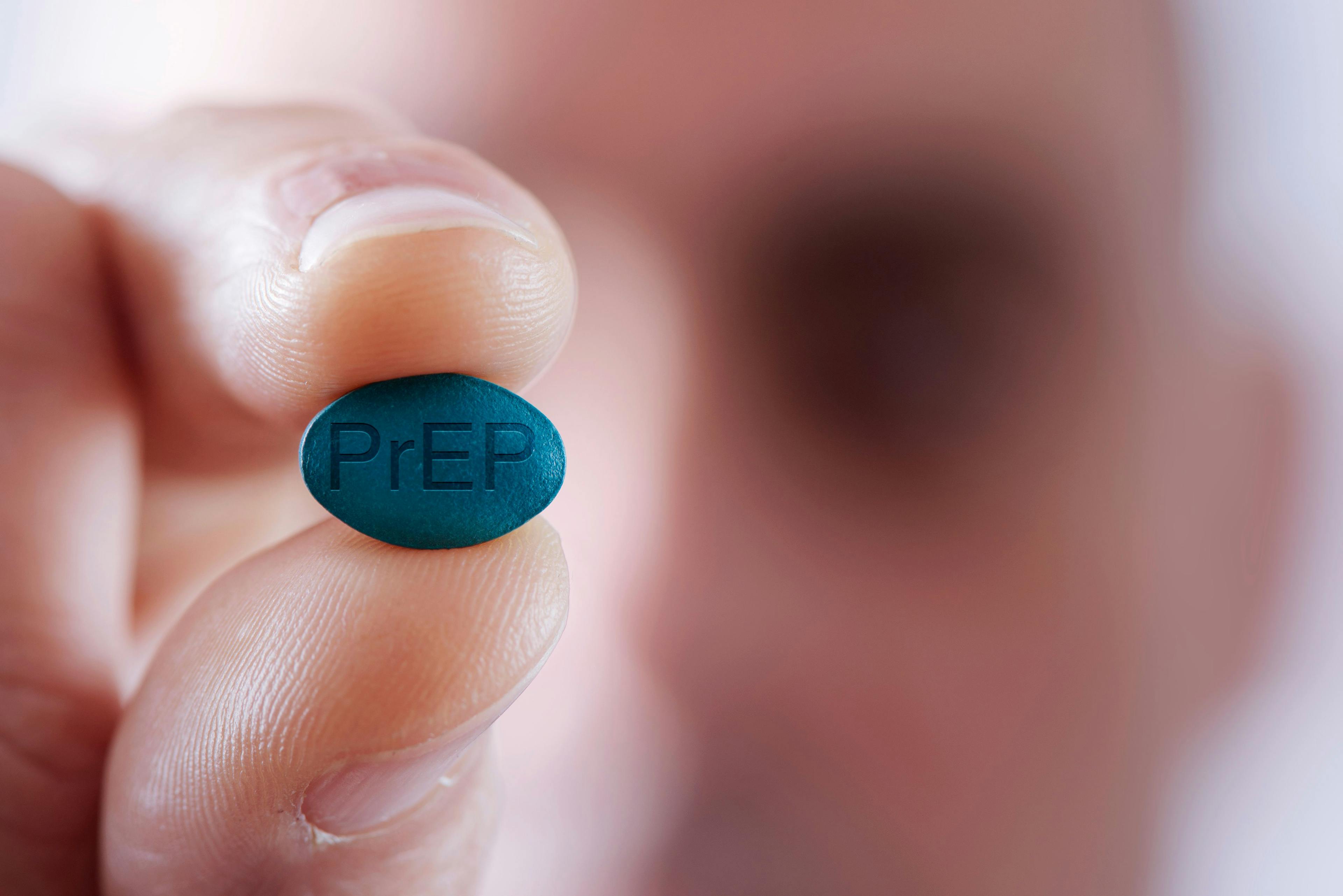 young man with a PrEP pill | Image credit: nito – stock.adobe.com