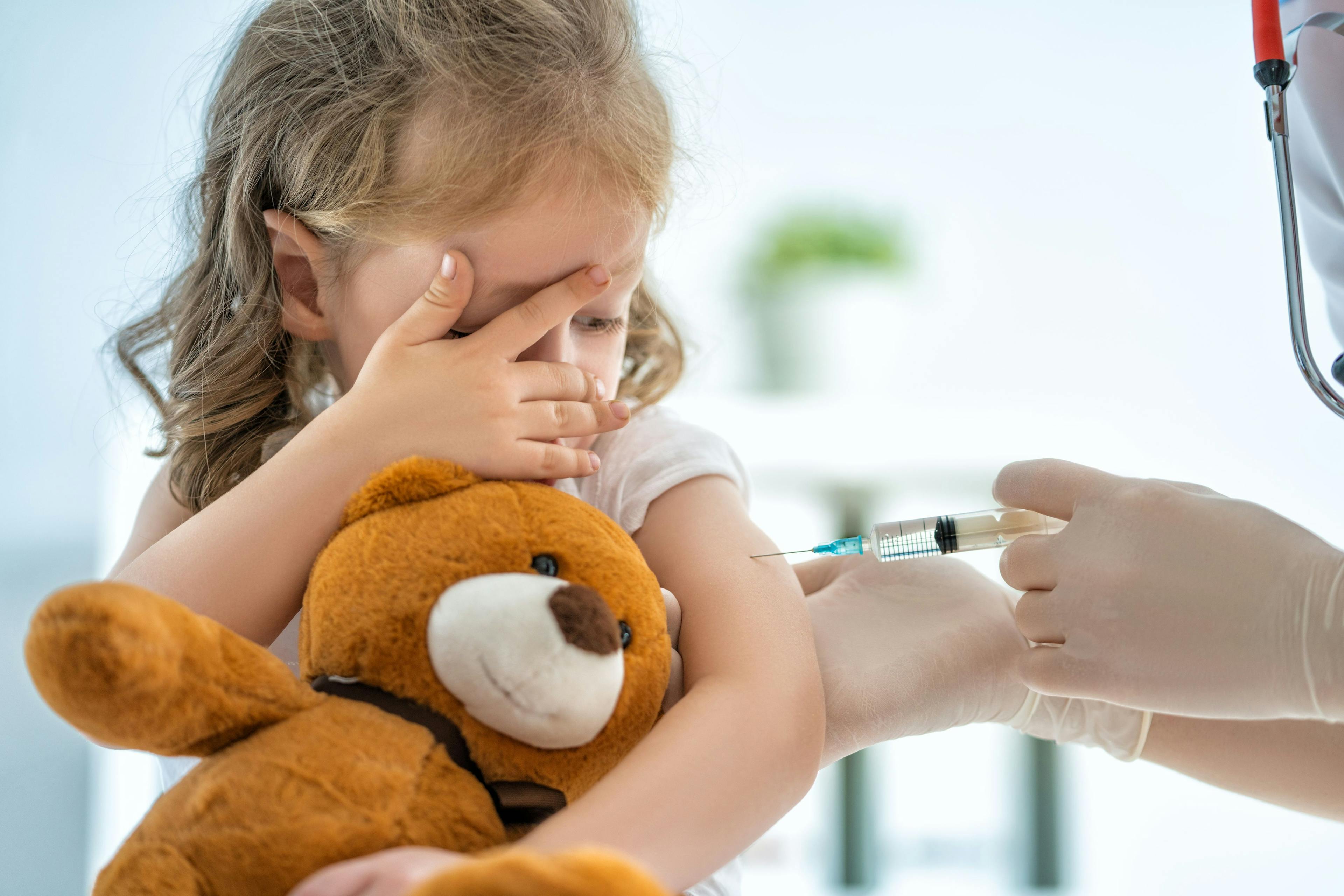 child receiving a vaccine