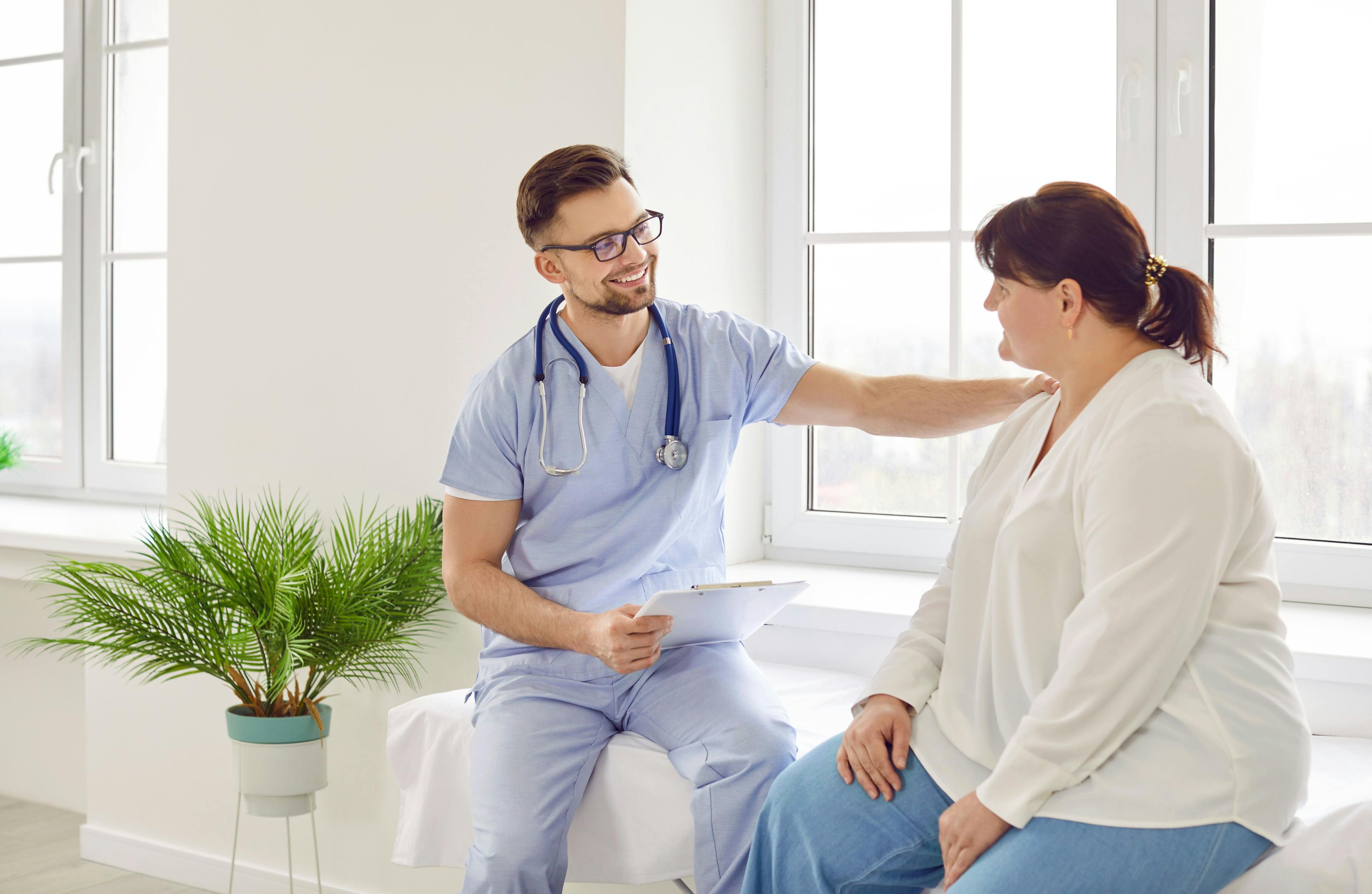 obese woman talking to doctor | Image credit: Studio Romantic - stock.adobe.com